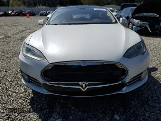 2014 Tesla Model S 60 with VIN 5YJSA1H12EFP51909, listed as a Copart auction lot 55489705 with Not Provided miles and Clean Title. Bid and sale history available at DreamBid. Image 11.