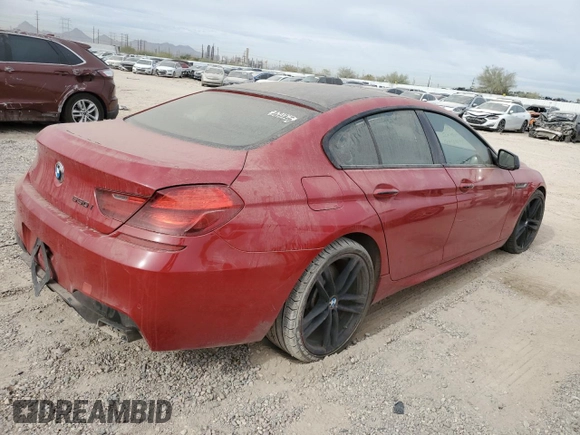 2013 BMW 6 Series 650i with VIN WBA6B2C50DDG66703, listed as a Copart auction lot 82225824 with 199,076 mi miles and Salvage Title. Bid and sale history available at DreamBid. Image 3.