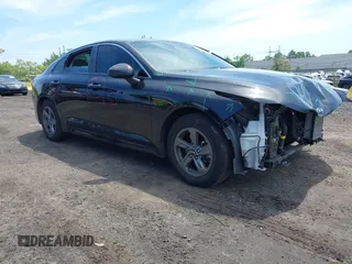 2021 Kia K5 LXS z VIN 5XXG14J25MG052084, wystawiony jako IAAI lot #42237008 z przebiegiem 31 278 mil mil oraz . Historia ofert i sprzedaży dostępna na DreamBid. Obrazek 1.