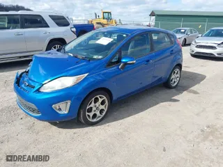 2011 Ford Fiesta SES with VIN 3FADP4FJ8BM119571, listed as a IAAI auction lot 41997018 with 108,487 mi miles. Bid and sale history available at carsss.com. Image 2.