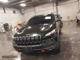 2015 Jeep Cherokee Trailhawk with VIN 1C4PJMBS8FW647639, listed as a IAAI auction lot 41187975 with 245,339 mi miles. Bid and sale history available at carsss.com. Image 12.