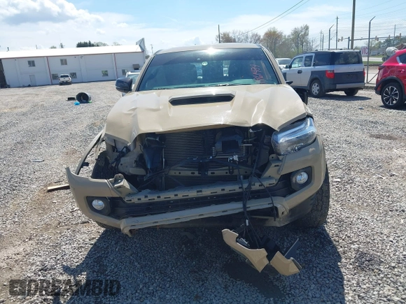 2020 Toyota Tacoma SR5 z VIN 3TMCZ5AN1LM300447, wystawiony jako IAAI lot #41961434 z przebiegiem 42 090 mil mil oraz . Historia ofert i sprzedaży dostępna na DreamBid. Obrazek 12.