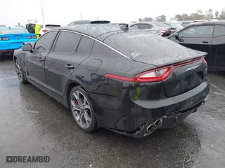 2018 Kia Stinger GT1 with VIN KNAE45LC4J6035780, listed as a IAAI auction lot 41560394 with 86,312 mi miles. Bid and sale history available at carsss.com. Image 3.
