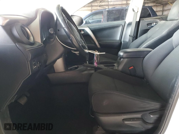2018 Toyota RAV4 XLE with VIN JTMWFREV2JJ740145, listed as a Copart auction lot 52214075 with 129,940 mi miles and Salvage title. Bid and sale history available at DreamBid. Image 7.