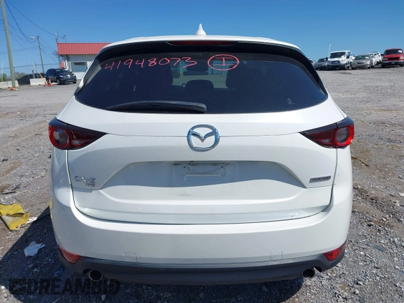 2021 Mazda CX-5 Touring z VIN JM3KFBCM2M1395663, wystawiony jako IAAI lot #41948073 z przebiegiem 47 029 mil mil oraz . Historia ofert i sprzedaży dostępna na DreamBid. Obrazek 16.