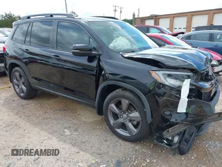 2020 Honda Passport Touring with VIN 5FNYF8H90LB005594, listed as a IAAI auction lot 42456803 with 63,451 mi miles and . Bid and sale history available at DreamBid. Image 1.