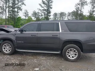 2015 GMC Yukon XL SLE z VIN 1GKS1GKC8FR507436, wystawiony jako IAAI lot #42113696 z przebiegiem Nie podano mil oraz . Historia ofert i sprzedaży dostępna na DreamBid. Obrazek 14.