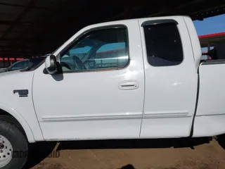 1999 Ford F-150 XL with VIN 2FTRX18L9XCA21004, listed as a IAAI auction lot 41616300 with 186,620 mi miles. Bid and sale history available at carsss.com. Image 14.