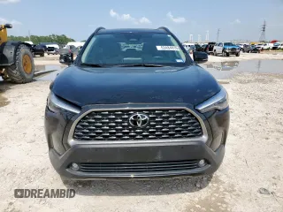 2023 Toyota Corolla Cross XLE with VIN 7MUDAAAG2PV072301, listed as a Copart auction lot 63484815 with 25,017 mi miles and Salvage title. Bid and sale history available at DreamBid. Image 5.