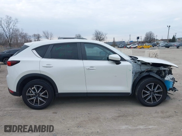 2018 Mazda CX-5 Touring z VIN JM3KFBCM6J0323107, wystawiony jako IAAI lot #41895519 z przebiegiem 86 124 mil mil oraz . Historia ofert i sprzedaży dostępna na DreamBid. Obrazek 13.