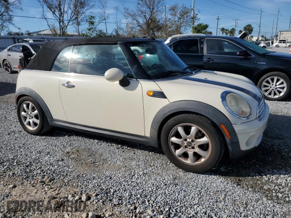 2010 MINI Convertible with VIN WMWMR3C55ATU97172, listed as a Copart auction lot 42726215 with 99,164 mi miles and Salvage Title. Bid and sale history available at DreamBid. Image 4.