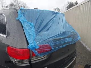 2015 Jeep Grand Cherokee Limited with VIN 1C4RJFBG8FC713253, listed as a IAAI auction lot 41757689 with 129,420 mi miles. Bid and sale history available at carsss.com. Image 6.
