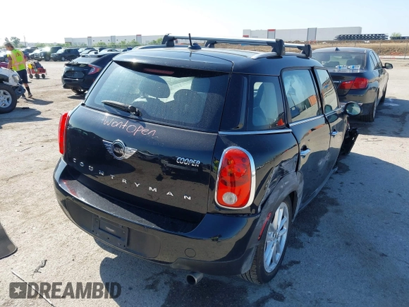 2015 MINI Countryman with VIN WMWZB3C54FWM33074, listed as a IAAI auction lot 42094992 with 86,704 mi miles and . Bid and sale history available at DreamBid. Image 4.