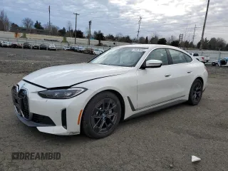 2024 BMW i4 xDrive40 with VIN WBY83FB02RFS41576, listed as a Copart auction lot 84876164 with 3,946 mi miles and Salvage Title. Bid and sale history available at carsss.com. Image 1.