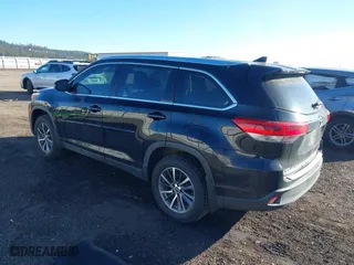 2019 Toyota Highlander SE with VIN 5TDJZRFH3KS580338, listed as a IAAI auction lot 41736059 with 128,487 mi miles. Bid and sale history available at carsss.com. Image 3.