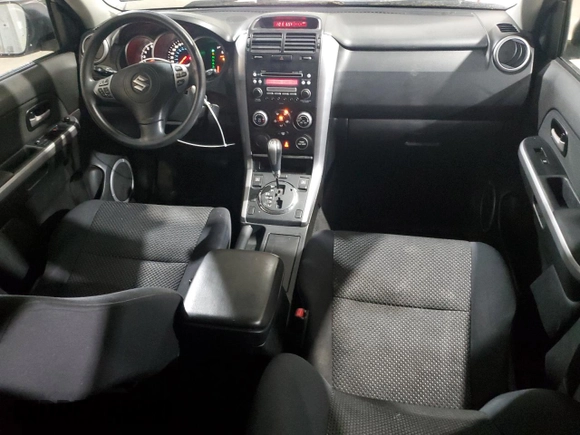 2006 Suzuki Grand Vitara Premium z VIN JS3TD943164103120, wystawiony jako Copart lot #56132585 z przebiegiem 143 313 mil mil oraz Szkoda całkowita • Salvage title. Historia ofert i sprzedaży dostępna na DreamBid. Obrazek 8.