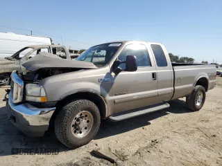 2002 Ford F-250 XL with VIN 1FTNX20F12EA19230, listed as a Copart auction lot 74044634 with 392,488 mi miles and Salvage title. Bid and sale history available at DreamBid. Image 1.