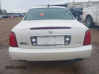 2002 Cadillac DeVille DHS z VIN 1G6KE57YX2U212020, wystawiony jako IAAI lot #41287342 z przebiegiem Nie podano mil oraz . Historia ofert i sprzedaży dostępna na DreamBid. Obrazek 16.