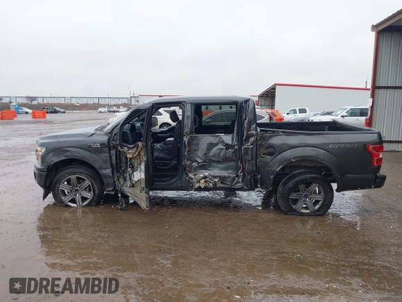 2019 Ford F-150 XL with VIN 1FTEW1C56KKC31025, listed as a IAAI auction lot 41452618 with 153,422 mi miles and . Bid and sale history available at DreamBid. Image 14.