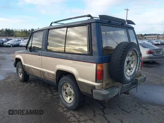 1986 Isuzu Trooper z VIN JACCH55L1G7801560, wystawiony jako IAAI lot #41878592 z przebiegiem 139 020 mil mil oraz . Historia ofert i sprzedaży dostępna na DreamBid. Obrazek 3.