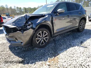 2018 Mazda CX-5 Grand Touring with VIN JM3KFADM2J1313418, listed as a Copart auction lot 49486875 with 94,930 mi miles and Salvage Title. Bid and sale history available at carsss.com. Image 1.