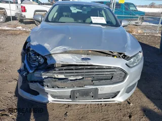 2015 Ford Fusion S Hybrid with VIN 3FA6P0UU7FR307568, listed as a IAAI auction lot 41421139 with 152,186 mi miles. Bid and sale history available at carsss.com. Image 6.