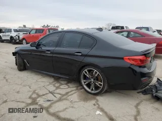 2018 BMW 5 Series M550i xDrive with VIN WBAJB9C56JB049524, listed as a Copart auction lot 43511805 with 55,759 mi miles and Salvage title. Bid and sale history available at DreamBid. Image 2.