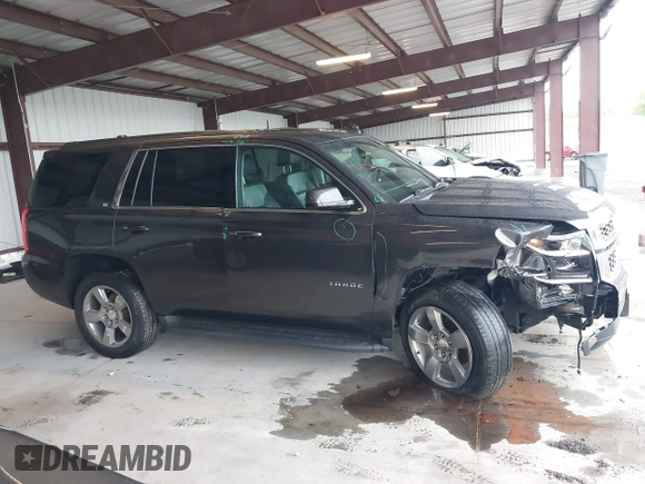 2017 Chevrolet Tahoe LT with VIN 1GNSKBKC8HR326004, listed as a IAAI auction lot 42256494 with 101,486 mi miles and . Bid and sale history available at DreamBid. Image 14.