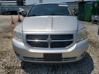 2010 Dodge Caliber Mainstreet z VIN 1B3CB3HA8AD565517, wystawiony jako Copart lot #60523535 z przebiegiem 99 982 mil mil oraz Szkoda całkowita • Salvage title. Historia ofert i sprzedaży dostępna na DreamBid. Obrazek 5.
