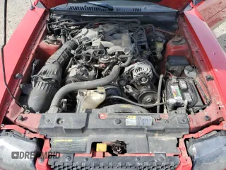 2003 Ford Mustang Deluxe z VIN 1FAFP44403F407589, wystawiony jako Copart lot #54002265 z przebiegiem 176 019 mil mil oraz Nie do naprawy • Non repairable. Historia ofert i sprzedaży dostępna na DreamBid. Obrazek 11.