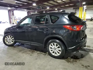 2013 Mazda CX-5 Touring with VIN JM3KE4CE8D0121607, listed as a Copart auction lot 56217965 with 143,861 mi miles and Clean Title. Bid and sale history available at DreamBid. Image 2.
