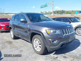 2016 Jeep Grand Cherokee Laredo z VIN 1C4RJFAG5GC390413, wystawiony jako IAAI lot #42254165 z przebiegiem 99 231 mil mil oraz . Historia ofert i sprzedaży dostępna na DreamBid. Obrazek 1.