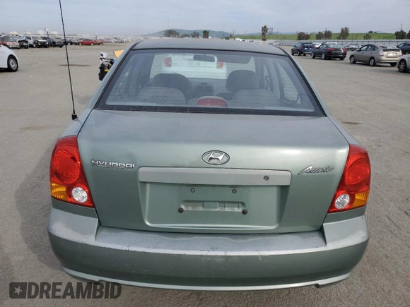 2004 Hyundai Accent GL with VIN KMHCG45C14U540938, listed as a Copart auction lot 46701935 with 71,891 mi miles and Salvage Title. Bid and sale history available at carsss.com. Image 6.