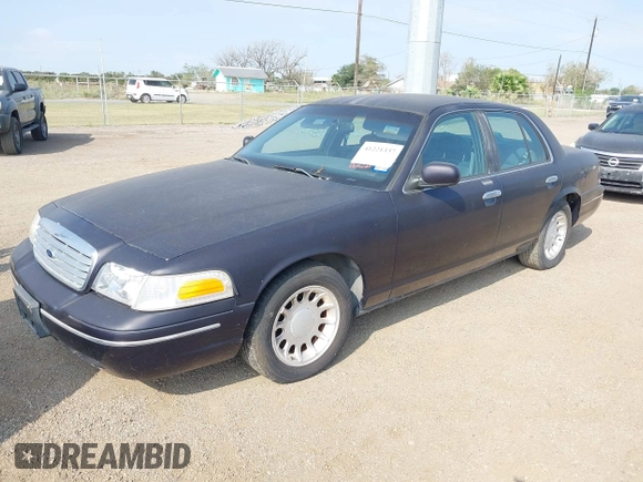2000 Ford Crown Victoria LX z VIN 2FAFP74W4YX188831, wystawiony jako IAAI lot #41221337 z przebiegiem 169 380 mil mil oraz . Historia ofert i sprzedaży dostępna na DreamBid. Obrazek 2.