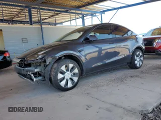2023 Tesla Model Y Long Range z VIN 7SAYGDEE1PF609185, wystawiony jako Copart lot #52174015 z przebiegiem 39 696 mil mil oraz Szkoda całkowita • Salvage title. Historia ofert i sprzedaży dostępna na DreamBid. Obrazek 1.