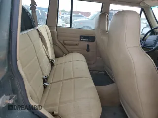 1996 Jeep Cherokee SE z VIN 1J4FJ28S9TL211073, wystawiony jako Copart lot #78052574 z przebiegiem 174 967 mil mil oraz Nie do naprawy • Non repairable. Historia ofert i sprzedaży dostępna na DreamBid. Obrazek 11.