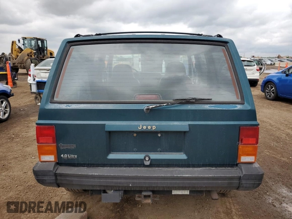 1996 Jeep Cherokee Sport with VIN 1J4FJ68S3TL251074, listed as a Copart auction lot 59593955 with 181,482 mi miles and Salvage title. Bid and sale history available at DreamBid. Image 6.