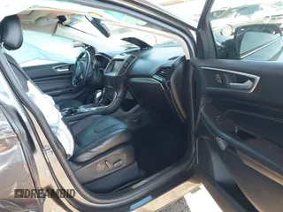 2015 Ford Edge Titanium z VIN 2FMTK3K90FBC12582, wystawiony jako IAAI lot #41860973 z przebiegiem Nie podano mil oraz . Historia ofert i sprzedaży dostępna na DreamBid. Obrazek 5.
