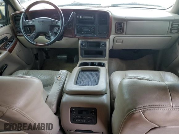 2004 GMC Yukon SLT z VIN 1GKEC13ZX4R203707, wystawiony jako Copart lot #56866075 z przebiegiem Nie podano mil oraz Szkoda całkowita • Salvage title. Historia ofert i sprzedaży dostępna na DreamBid. Obrazek 8.