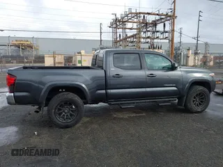 2022 Toyota Tacoma SR5 with VIN 3TMBZ5DN2NM034561, listed as a IAAI auction lot 40867443 with 51,728 mi miles and . Bid and sale history available at DreamBid. Image 13.