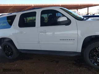 2012 Chevrolet Suburban LT with VIN 1GNSCJE05CR318556, listed as a IAAI auction lot 41654002 with 222,329 mi miles. Bid and sale history available at carsss.com. Image 14.