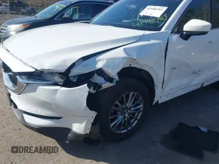 2017 Mazda CX-5 Touring z VIN JM3KFBCL8H0214052, wystawiony jako IAAI lot #41940783 z przebiegiem 120 083 mil mil oraz . Historia ofert i sprzedaży dostępna na DreamBid. Obrazek 6.
