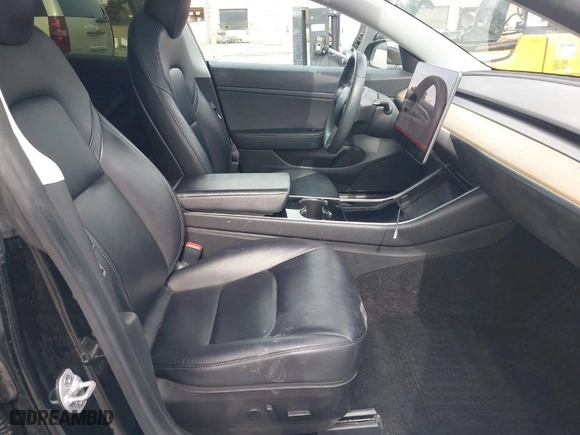 2020 Tesla Model 3 Standard Range Plus with VIN 5YJ3E1EA8LF645569, listed as a IAAI auction lot 41697452 with 84,590 mi miles. Bid and sale history available at carsss.com. Image 5.