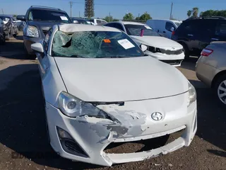 2016 Scion FR-S with VIN JF1ZNAA19G9709205, listed as a IAAI auction lot 42077281 with 68,549 mi miles. Bid and sale history available at carsss.com. Image 6.