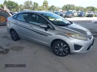 2012 Ford Fiesta SE z VIN 3FADP4BJ4CM186434, wystawiony jako IAAI lot #42509010 z przebiegiem 123 734 mil mil oraz . Historia ofert i sprzedaży dostępna na DreamBid. Obrazek 1.