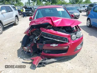 2012 Chevrolet Sonic LT with VIN 1G1JC6SH7C4135418, listed as a IAAI auction lot 42464564 with 169,035 mi miles and . Bid and sale history available at DreamBid. Image 6.