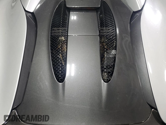 2018 McLaren 570S z VIN SBM13FAA2JW004594, wystawiony jako Copart lot #49730155 z przebiegiem Nie podano mil oraz Szkody całkowita. Historia ofert i sprzedaży dostępna na DreamBid. Obrazek 11.