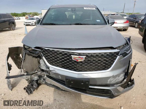 2024 Cadillac XT6 FWD Luxury with VIN 1GYKPAR41RZ700452, listed as a Copart auction lot 57675945 with 27,449 mi miles and Salvage title. Bid and sale history available at DreamBid. Image 5.