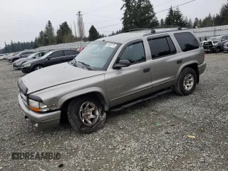 2000 Dodge Durango with VIN 1B4HS28Z6YF121861, listed as a Copart auction lot 87669175 with 115,990 mi miles and Salvage Title. Bid and sale history available at DreamBid. Image 1.