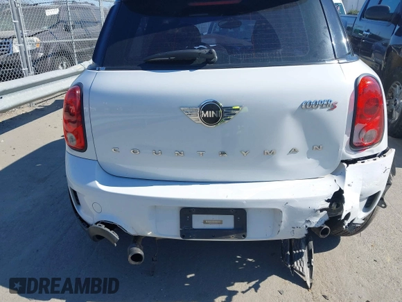 2014 MINI Countryman S with VIN WMWZC3C52EWP25060, listed as a IAAI auction lot 41642855 with 240,396 mi miles and . Bid and sale history available at DreamBid. Image 12.